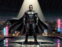 A caped superhero in a dark armored suit stands on a rain-slicked rooftop at night, city lights glittering far below, cape billowing in the wind. A single dramatic spotlight from above cuts through the rain, illuminating the chest emblem and jaw. Neon reflections from street signs pool on the wet concrete. Style: cinematic comic-book realism. Mood: intense and heroic.